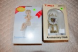 Timex Porcelain Base And Dial Anniversary Clock, And Porcelain Collectable Cherub And Bird