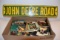 Large Assortment Of John Deere Toy Catalogs And John Deere Road Sign Reproduction