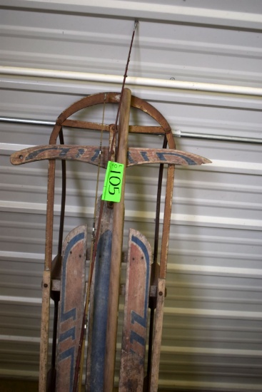 two old fishing poles & sled