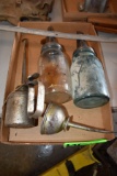 Assortment Of Oil Bottles And Oil Cans