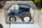 Ertl New Holland 7840 Tractor, 1/16th Scale With Box Has Stain