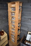 Wooden Movie Rack With Assortment Of Potpourri Jars, And Cooking DVDs