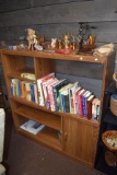 Entertainment Center With Assortment Of Books And Knick Knacks