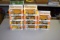 (11) Ertl Mighty Movers 1/64th scale construction toys, in boxes