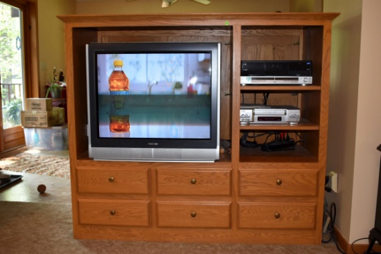 Oak Entertainment Center includes TV only(back opens up with 3 doors)