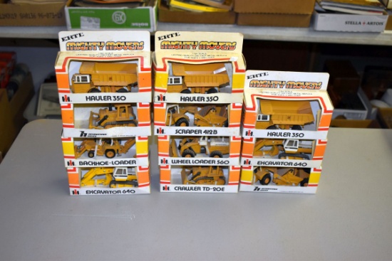 (11) Ertl Mighty Movers 1/64th scale construction toys, in boxes