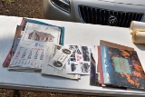 Assortment of calendars, posters and newspapers