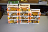 (11) Ertl Mighty Movers 1/64th scale construction toys, in boxes