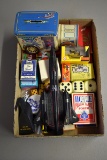 Assortment of playing cards, dice, toys, snap caps
