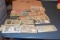 Large Assortment of Foreign Paper Money in plastic sleeves