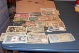 Large Assortment of Foreign Paper Money in plastic sleeves