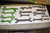 13 John Deere, Deering, Montgomery Ward, Armstrong, Vintage Wrenches Mounted on Pegboard