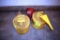 2 safety cans and funnels, located building 1