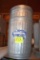 2 steel garbage cans with covers, located building 5