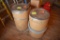 2 barrels full of burlap and plastic bags, located building 5