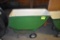 Fiberglass feed cart with solid tires, located building 6
