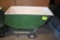 Fiberglass feed cart with solid tires, located building 6