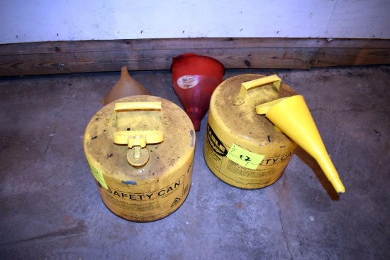 2 safety cans and funnels, located building 1