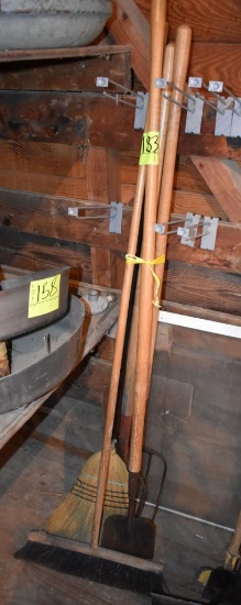 2 forks, 2 brooms and scraper, located building 5