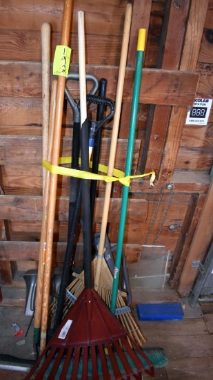 Assortment of garden handled tools and post ponder, located building 5
