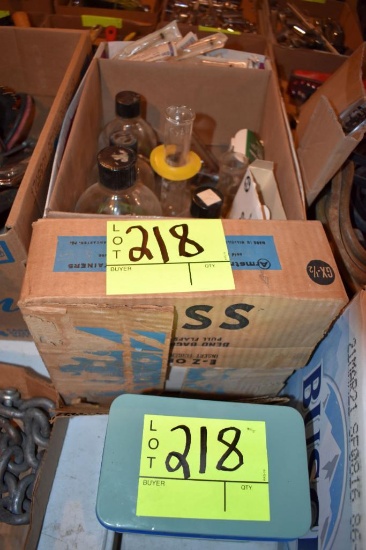 Assortment of beakers, syringes, Small container of L-PHENYLALANINE, located building 5