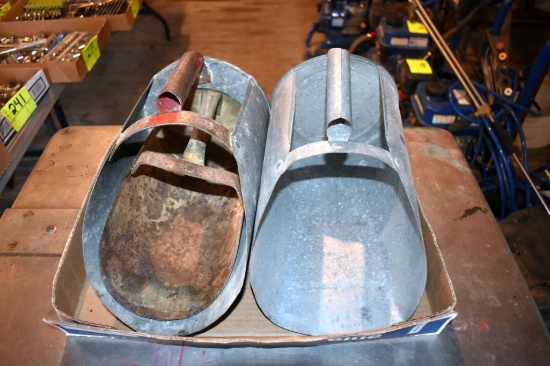 3 Metal feed scoops, located building 5
