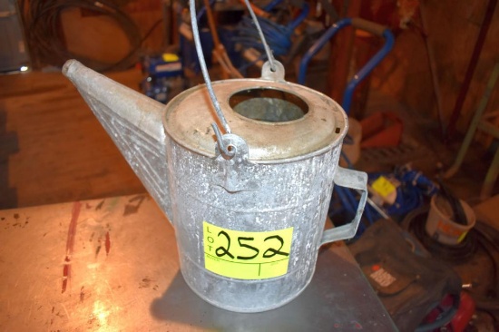 Metal water can, located building 5