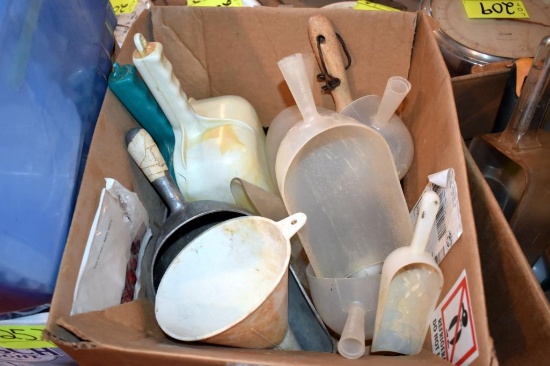 Assortment of feed and measuring scoops, located building 5
