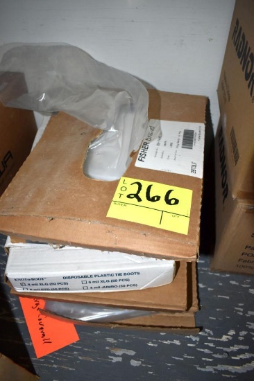 6 Boxes of disposable boot covers, located building 5