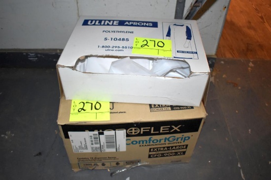 2 Open boxes of aprons, located building 5