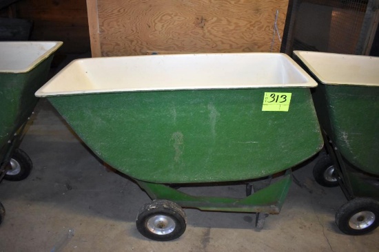 Fiberglass feed cart with solid tires, located building 6