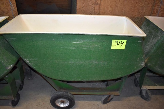 Fiberglass feed cart with solid tires, located building 6