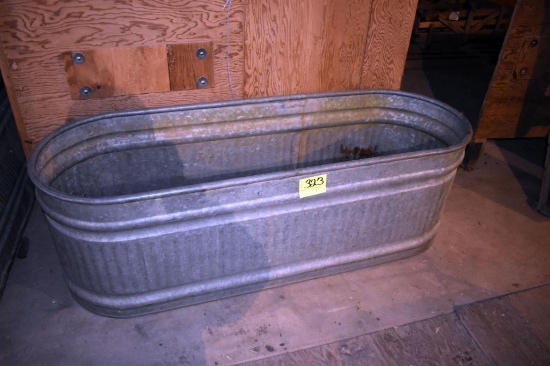 Galvanized water tank has hole, located building 6