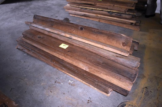 Pile of 1x8 Lumber, located building 2
