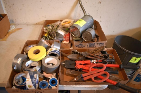Assortment of duck tape, oil cans, bolt cutters, tools, located building 5