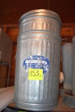 2 steel garbage cans with covers, located building 5
