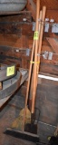 2 forks, 2 brooms and scraper, located building 5