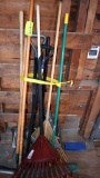 Assortment of garden handled tools and post ponder, located building 5