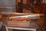 Pipe wrench, yard sticks and level, located building 5