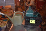 3 Plastic water can, located building 5