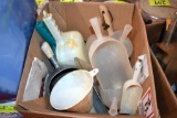 Assortment of feed and measuring scoops, located building 5