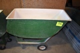 Fiberglass feed cart with solid tires, located building 6