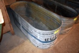 Galvanized water tank has hole, located building 6
