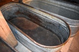 Galvanized water tank has hole, located building 6