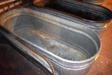 Galvanized water tank has hole, located building 6