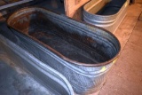 Galvanized water tank has hole, located building 6