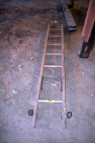 Wooden ladder, located building 6