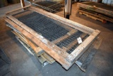 Assorted sizes of wooden framed wire panels, located building 6