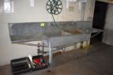 11' Double compartment galvanized sink, hose reel and footbaths , located building 2