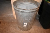 2 Metal garbage cans no lids, located building 7